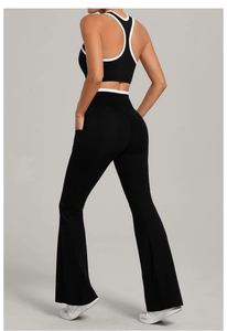 Detail of color-block yoga set featuring U-neck tank top and flared leggings with pockets