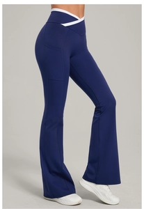 Detail view of high-waist yoga flare pants with V-cross waistband and side pockets