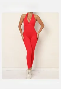 Close-up of red high-waist yoga bodysuit with scrunch butt lifting detail and open back