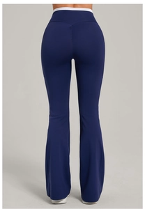 Macro view of high-waist flared yoga pants featuring blue and white contrast waistband design