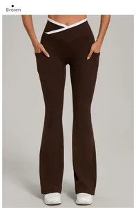 Detail of high waisted brown yoga flare pants with white cross waist and side pockets