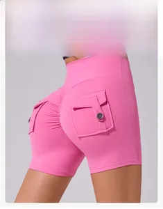 Detailed back view of pink high-waisted yoga shorts with scrunch butt and cargo pockets
