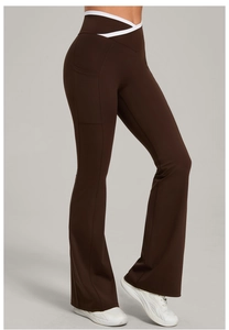 Detail view of coffee flare yoga pants with white V-cross waist and side pocket