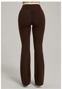 Macro view of brown flared yoga pants showing high-waist white trim and ruched butt-lift detail