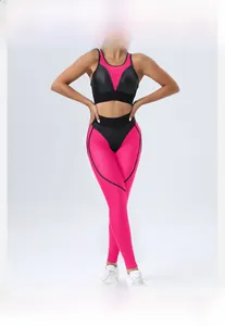 Detail of fuchsia and black yoga set showing honeycomb breathable fabric and mesh stitching