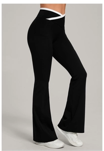 Detail of cross-over V-waistband with contrast trim and side pockets on yoga flare pants