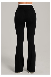 Close-up of high-waist yoga flare pants with white contrast patchwork on the back