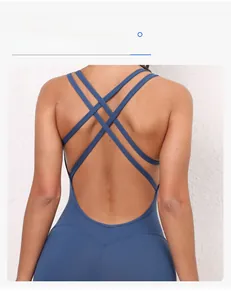 Detail of dark blue yoga jumpsuit featuring criss-cross back straps and V-waist design
