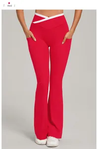 Detail view of the red yoga flare pants with a contrasting cross-waist design and pockets