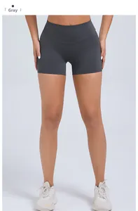 Close-up of high-waisted grey yoga shorts featuring tummy control and lifting seams