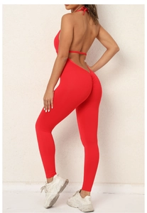 Close-up of red lace-up backless yoga jumpsuit with ruched peach butt lift texture