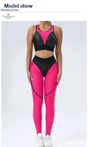 Detail of high-waist yoga leggings and mesh sports bra in fluorescent pink and black