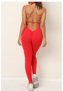 Detail of red backless yoga jumpsuit featuring scrunch butt lifting texture