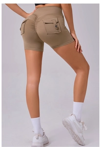 Detail of khaki scrunch butt yoga shorts with high waist and cargo flap button pockets