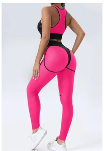 Close-up of the honeycomb knit texture and pink-black patchwork on yoga leggings