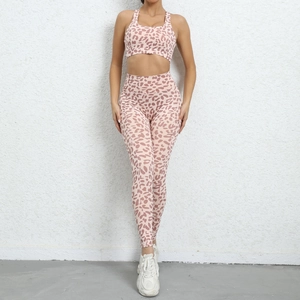 Detail of pink leopard print yoga set with racerback bra and high-waist leggings