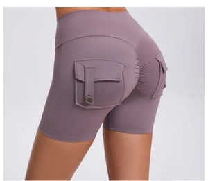 Detail view of high waist scrunch butt gym shorts with lilac cargo pockets and buttons