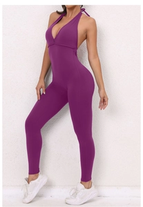 Detail of purple backless yoga jumpsuit with cross straps and moisture-wicking fabric