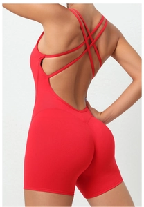 Detailed back view of red yoga bodysuit showing cross strap design and slim fit fabric
