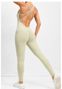 Detail of cross-back straps and scrunch butt lifting design on green yoga bodysuit