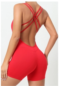 Detail of red backless yoga bodysuit with thin crisscross straps and peach butt lift effect