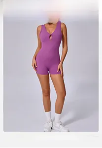 Detail view of purple deep V-neck yoga bodysuit with hollow-out design and high elasticity