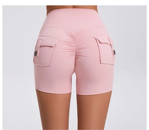 Detailed back view of pink scrunch butt workout shorts with buttoned cargo pockets