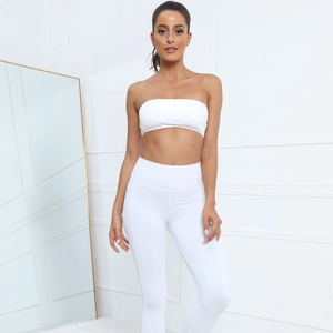 Detailed view of white strapless yoga sports bra and high waisted fitness leggings