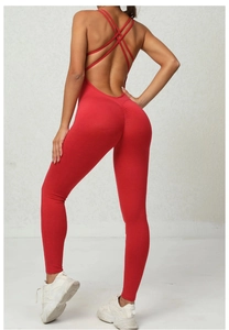 Detail of red backless yoga jumpsuit featuring scrunch butt and crisscross straps