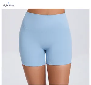 Detail view of light blue high-waisted yoga shorts in moisture-wicking fabric