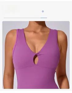 Detail of purple yoga top featuring hollow out twist knot design and snug fit fabric