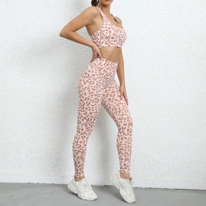 Detail view of pink leopard print yoga set with high-waisted leggings and sports bra