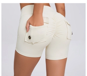 Detail of high waist beige cargo yoga shorts with side pockets and button accents