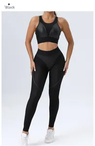 Detail of black sports bra with breathable mesh panels and high-waisted textured yoga leggings