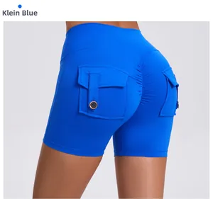 Detail view of high-waist scrunch butt yoga shorts in Klein blue with cargo pocket and button