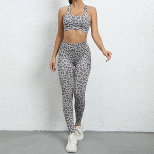 Detail of leopard print yoga set featuring high waist leggings and racerback sports bra
