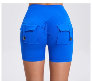 Detail of high waist scrunch butt yoga shorts with utility pockets and button accents