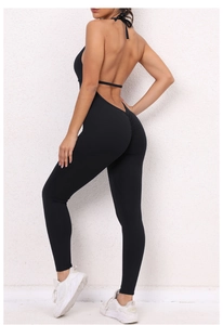 Detail showing the lace-up halter back and scrunch butt design of the black yoga jumpsuit