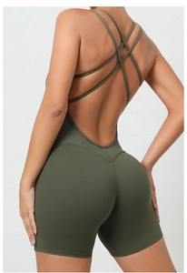 Detail of cross-back straps and open-back design on green yoga bodysuit for women