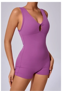 Close-up of purple yoga jumpsuit featuring a V-neck, front knot, and hollow-out detail