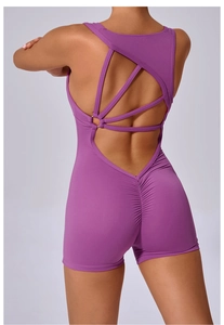 Detail view of purple scrunch leggings with crisscross back straps and hollow-out design