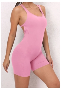 Close-up of pink yoga bodysuit with thin straps and open back design for fitness
