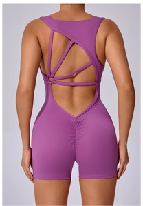 Detail of cross-back lilac yoga bodysuit with ruched scrunch butt lifting effect