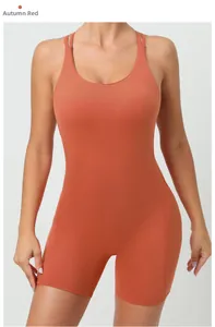 Front view of autumn red cross-back yoga bodysuit with slim fit athletic cut