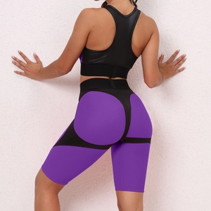 Detail view of honeycomb texture purple leggings and black racerback sports vest