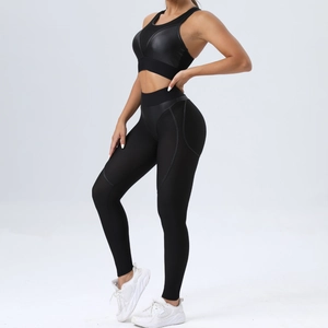 Women's tight yoga set with mesh sports bra and high waist leggings for fitness gym workout