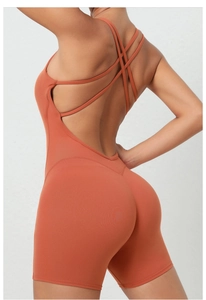 Detailed back view of brick red yoga jumpsuit featuring multi-cross strappy design