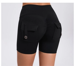 Close-up of black scrunch butt shorts with high waist and cargo flap button pockets