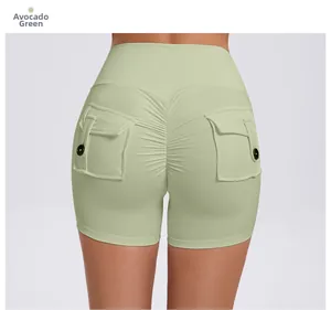 Close-up of high-waist scrunch butt gym shorts in avocado green with buttoned cargo pockets