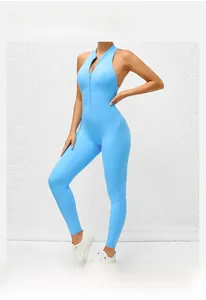 Detail of light blue yoga jumpsuit with front zipper and athletic stretch fabric